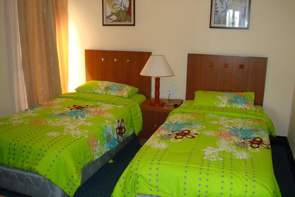 Dorcas Service Apartment - Marina Court Кота-Кінабалу Номер фото